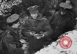 Image of British soldiers sharing Christmas pudding in trenches France, 1916, second 41 stock footage video 65675042463