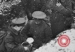 Image of British soldiers sharing Christmas pudding in trenches France, 1916, second 43 stock footage video 65675042463