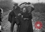 Image of French refugees with American soldiers in World War I France, 1918, second 33 stock footage video 65675042495