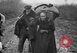 Image of French refugees with American soldiers in World War I France, 1918, second 34 stock footage video 65675042495