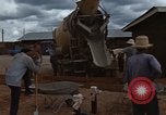 Image of pouring cement Thailand, 1966, second 29 stock footage video 65675042841