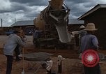 Image of pouring cement Thailand, 1966, second 30 stock footage video 65675042841