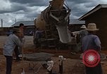 Image of pouring cement Thailand, 1966, second 31 stock footage video 65675042841