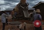 Image of pouring cement Thailand, 1966, second 33 stock footage video 65675042841