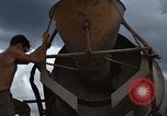 Image of pouring cement Thailand, 1966, second 37 stock footage video 65675042841