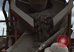 Image of pouring cement Thailand, 1966, second 40 stock footage video 65675042841