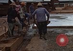 Image of pouring cement Thailand, 1966, second 54 stock footage video 65675042841