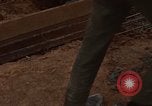 Image of pouring cement Thailand, 1966, second 60 stock footage video 65675042841