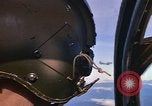 Image of A 1E Skyraider aircraft fire rockets at enemy ground target Southeast Asia, 1966, second 4 stock footage video 65675042960