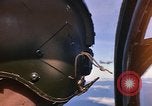 Image of A 1E Skyraider aircraft fire rockets at enemy ground target Southeast Asia, 1966, second 6 stock footage video 65675042960