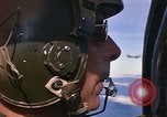 Image of A 1E Skyraider aircraft fire rockets at enemy ground target Southeast Asia, 1966, second 7 stock footage video 65675042960