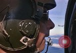 Image of A 1E Skyraider aircraft fire rockets at enemy ground target Southeast Asia, 1966, second 8 stock footage video 65675042960