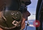 Image of A 1E Skyraider aircraft fire rockets at enemy ground target Southeast Asia, 1966, second 9 stock footage video 65675042960