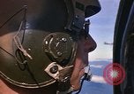 Image of A 1E Skyraider aircraft fire rockets at enemy ground target Southeast Asia, 1966, second 11 stock footage video 65675042960
