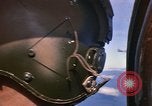 Image of A 1E Skyraider aircraft fire rockets at enemy ground target Southeast Asia, 1966, second 12 stock footage video 65675042960