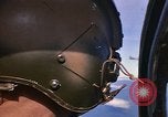 Image of A 1E Skyraider aircraft fire rockets at enemy ground target Southeast Asia, 1966, second 13 stock footage video 65675042960