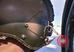 Image of A 1E Skyraider aircraft fire rockets at enemy ground target Southeast Asia, 1966, second 14 stock footage video 65675042960