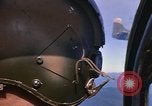 Image of A 1E Skyraider aircraft fire rockets at enemy ground target Southeast Asia, 1966, second 15 stock footage video 65675042960
