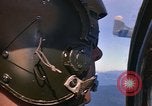 Image of A 1E Skyraider aircraft fire rockets at enemy ground target Southeast Asia, 1966, second 16 stock footage video 65675042960