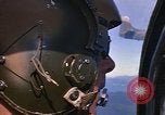 Image of A 1E Skyraider aircraft fire rockets at enemy ground target Southeast Asia, 1966, second 18 stock footage video 65675042960