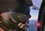 Image of A 1E Skyraider aircraft fire rockets at enemy ground target Southeast Asia, 1966, second 19 stock footage video 65675042960