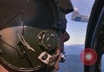 Image of A 1E Skyraider aircraft fire rockets at enemy ground target Southeast Asia, 1966, second 20 stock footage video 65675042960