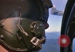 Image of A 1E Skyraider aircraft fire rockets at enemy ground target Southeast Asia, 1966, second 21 stock footage video 65675042960