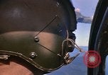 Image of A 1E Skyraider aircraft fire rockets at enemy ground target Southeast Asia, 1966, second 23 stock footage video 65675042960
