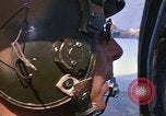 Image of A 1E Skyraider aircraft fire rockets at enemy ground target Southeast Asia, 1966, second 26 stock footage video 65675042960