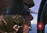 Image of A 1E Skyraider aircraft fire rockets at enemy ground target Southeast Asia, 1966, second 27 stock footage video 65675042960