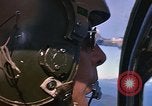 Image of A 1E Skyraider aircraft fire rockets at enemy ground target Southeast Asia, 1966, second 28 stock footage video 65675042960