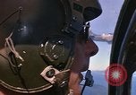Image of A 1E Skyraider aircraft fire rockets at enemy ground target Southeast Asia, 1966, second 29 stock footage video 65675042960