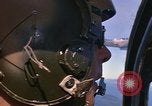 Image of A 1E Skyraider aircraft fire rockets at enemy ground target Southeast Asia, 1966, second 30 stock footage video 65675042960