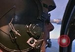 Image of A 1E Skyraider aircraft fire rockets at enemy ground target Southeast Asia, 1966, second 31 stock footage video 65675042960