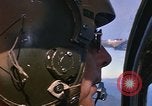 Image of A 1E Skyraider aircraft fire rockets at enemy ground target Southeast Asia, 1966, second 32 stock footage video 65675042960