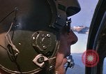 Image of A 1E Skyraider aircraft fire rockets at enemy ground target Southeast Asia, 1966, second 33 stock footage video 65675042960