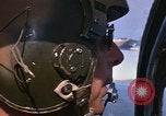 Image of A 1E Skyraider aircraft fire rockets at enemy ground target Southeast Asia, 1966, second 34 stock footage video 65675042960