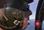 Image of A 1E Skyraider aircraft fire rockets at enemy ground target Southeast Asia, 1966, second 39 stock footage video 65675042960
