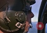 Image of A 1E Skyraider aircraft fire rockets at enemy ground target Southeast Asia, 1966, second 41 stock footage video 65675042960