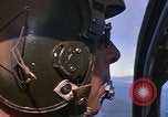 Image of A 1E Skyraider aircraft fire rockets at enemy ground target Southeast Asia, 1966, second 42 stock footage video 65675042960