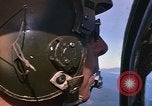 Image of A 1E Skyraider aircraft fire rockets at enemy ground target Southeast Asia, 1966, second 43 stock footage video 65675042960