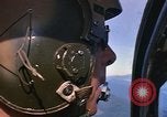 Image of A 1E Skyraider aircraft fire rockets at enemy ground target Southeast Asia, 1966, second 45 stock footage video 65675042960