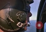 Image of A 1E Skyraider aircraft fire rockets at enemy ground target Southeast Asia, 1966, second 46 stock footage video 65675042960