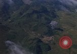 Image of A 1E Skyraider aircraft fire rockets at enemy ground target Southeast Asia, 1966, second 47 stock footage video 65675042960