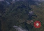 Image of A 1E Skyraider aircraft fire rockets at enemy ground target Southeast Asia, 1966, second 51 stock footage video 65675042960