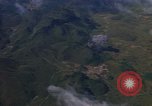Image of A 1E Skyraider aircraft fire rockets at enemy ground target Southeast Asia, 1966, second 52 stock footage video 65675042960