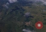 Image of A 1E Skyraider aircraft fire rockets at enemy ground target Southeast Asia, 1966, second 56 stock footage video 65675042960