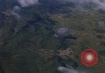 Image of A 1E Skyraider aircraft fire rockets at enemy ground target Southeast Asia, 1966, second 57 stock footage video 65675042960