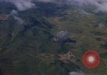 Image of A 1E Skyraider aircraft fire rockets at enemy ground target Southeast Asia, 1966, second 59 stock footage video 65675042960