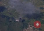Image of A 1E Skyraider aircraft fire rockets at enemy ground target Southeast Asia, 1966, second 60 stock footage video 65675042960